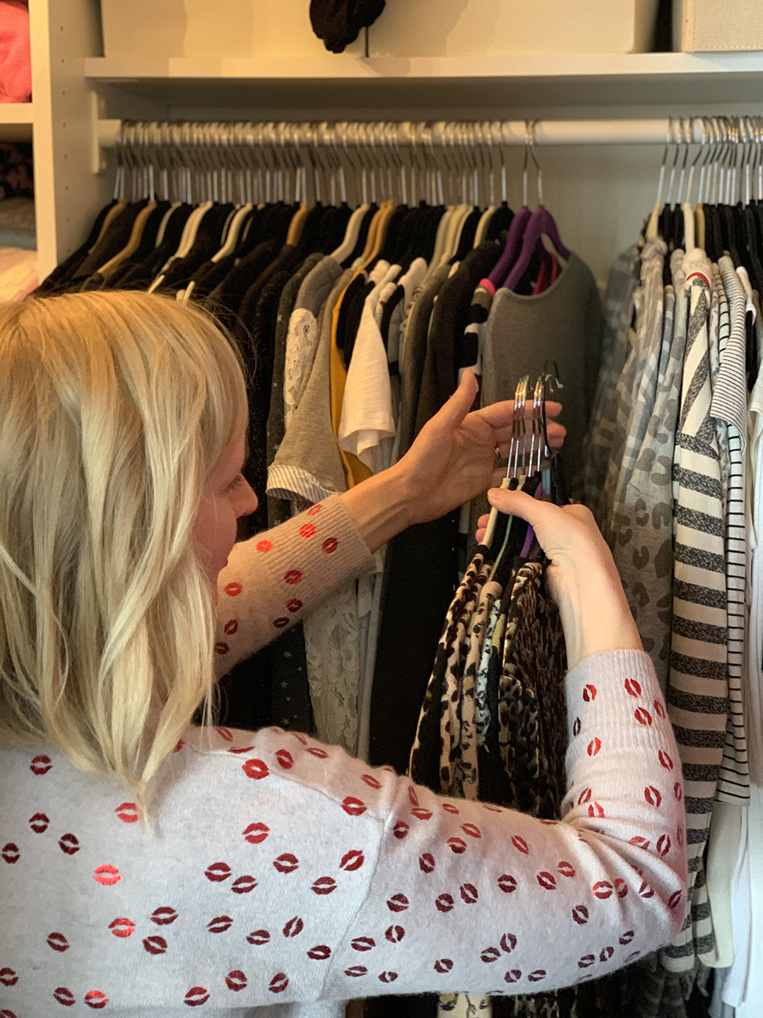 Organizing a closet by color and pattern